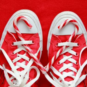 Red and white candy canes on red Converse sneakers